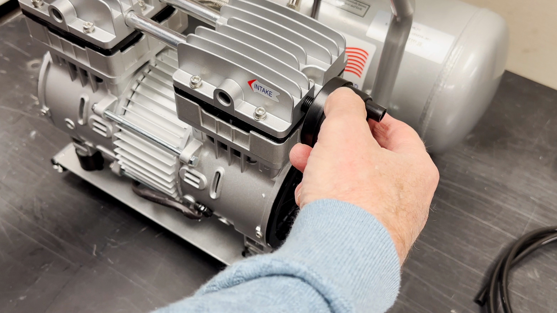 Attaching muffler to the air compressor