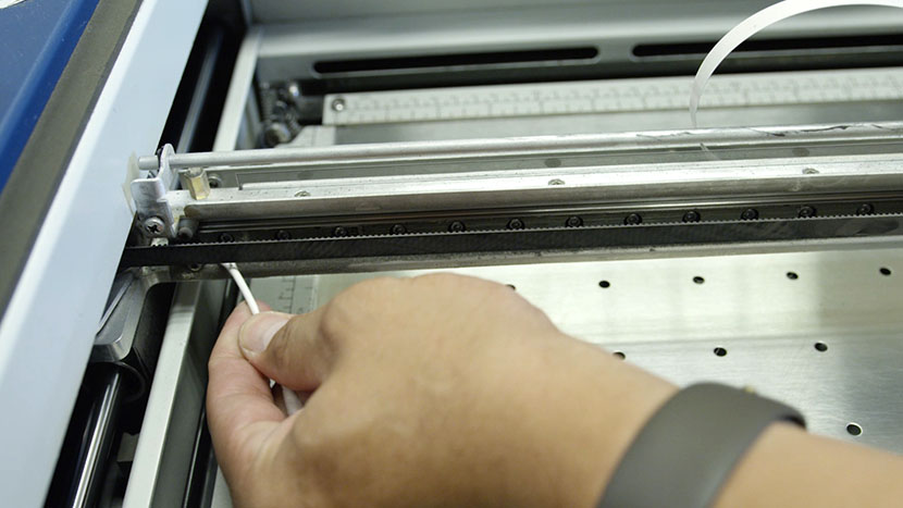 Run cotton swabs along the bottom of the bearing rail until they come away clean. Running a cotton swab along the bottom of the bearing rail.