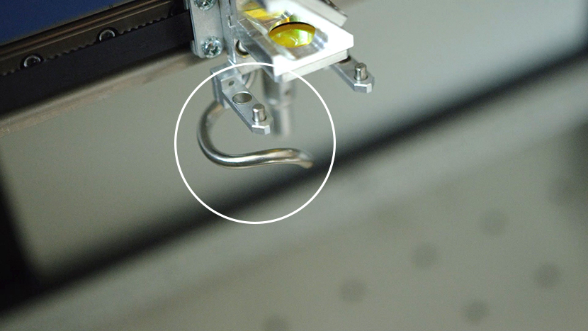 The Air Assist Tube helps give you clean cuts and engravings. The Air Assist Tube on the lens assembly.