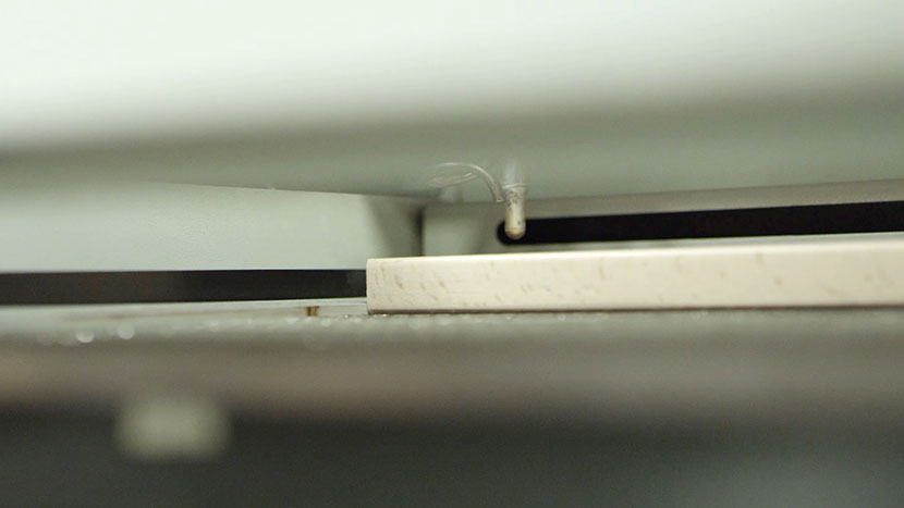 The autmoatic focus gauge makes focusing the laser for your material's thickness very easy. The automatic focus gauge in action.