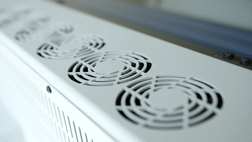The air intake holes provide air for the laser's heat sink fans. The top-side air intake holes.