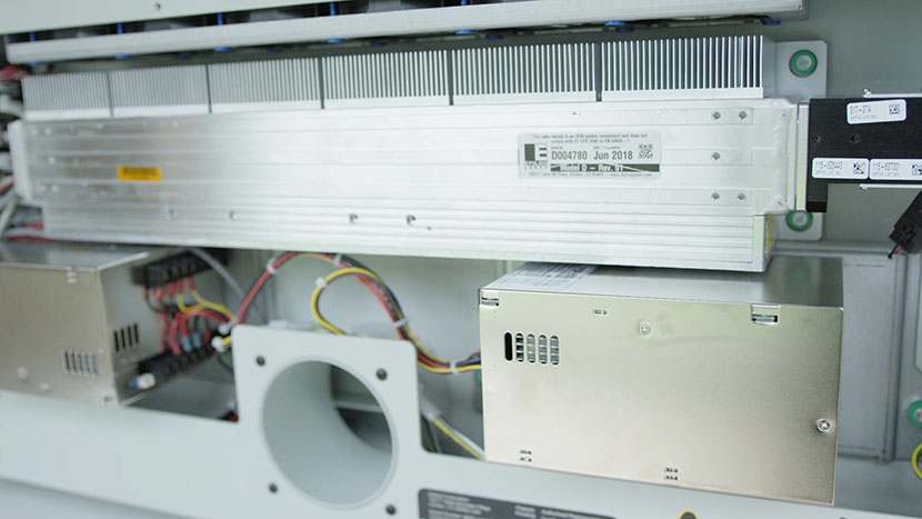 The rear of the machine houses the laser tube and power supply. The interior of the back of the machine.