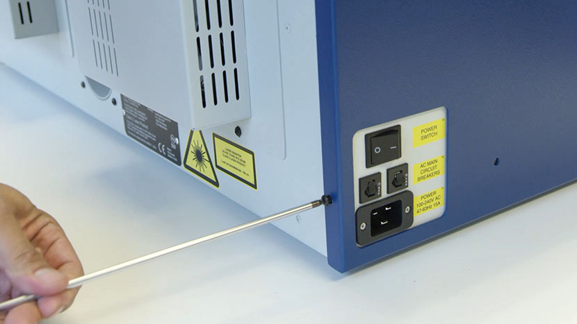 Remove the screws on the back of the left panel Removing the screws on the left panel's back face