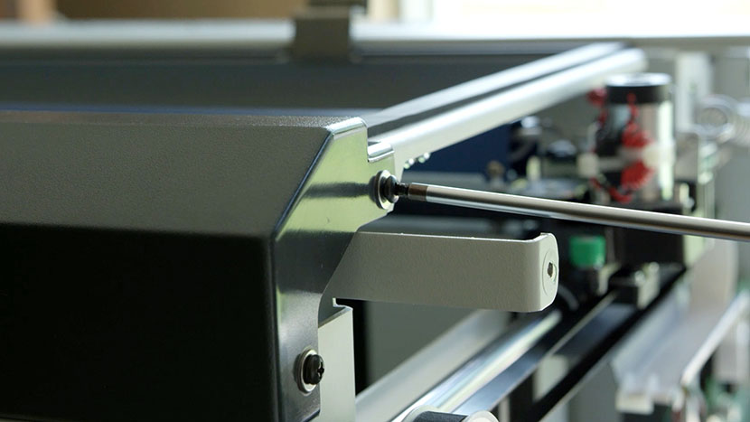 Remove the two screws on the right side of the bezel Removing the screws that secure the right side of the control panel bezel