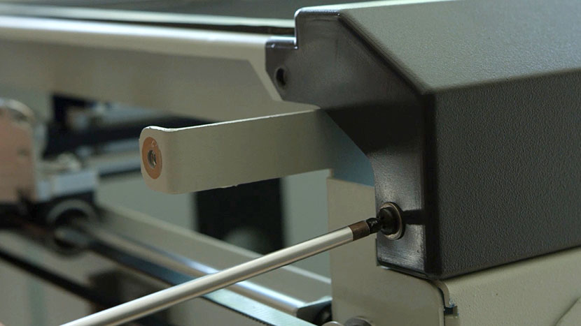 Remove the two screws on the left side of the bezel Removing the screws that secure the left side of the control panel bezel