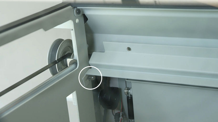 Loosen the two 3/16 inch nuts at the bottom corners One of the two bottom nuts that need to be loosened to remove the bottom panel