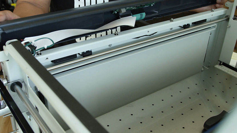 Slide the bezel out from under the loosened nuts Removing the bezel