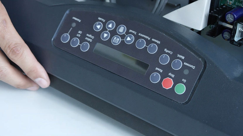 Press the new keypad's adhesive back to the recess in the bezel The new keypad applied to the bezel recess