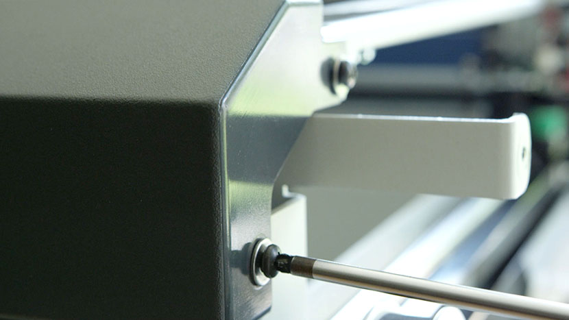 Insert the two screws on the right side of the bezel Inserting the two screws on the right side of the bezel