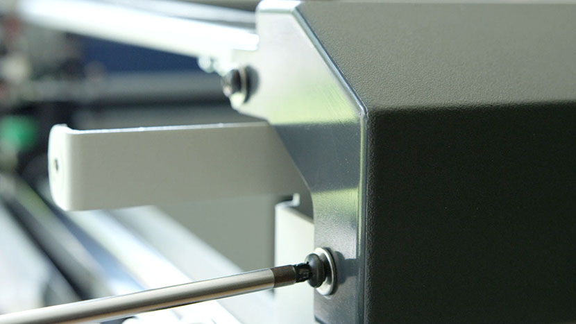 Insert the two screws on the left side of the bezel Inserting the two screws on the left side of the bezel