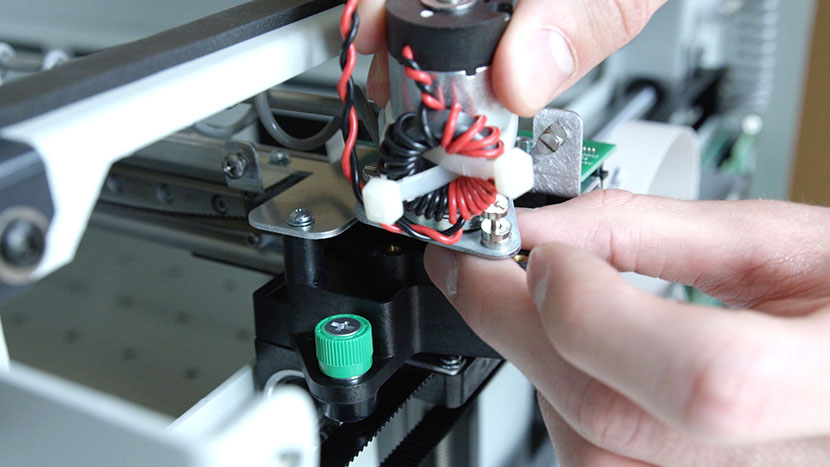 Install the new X-Motor. Installing the new X-Motor.