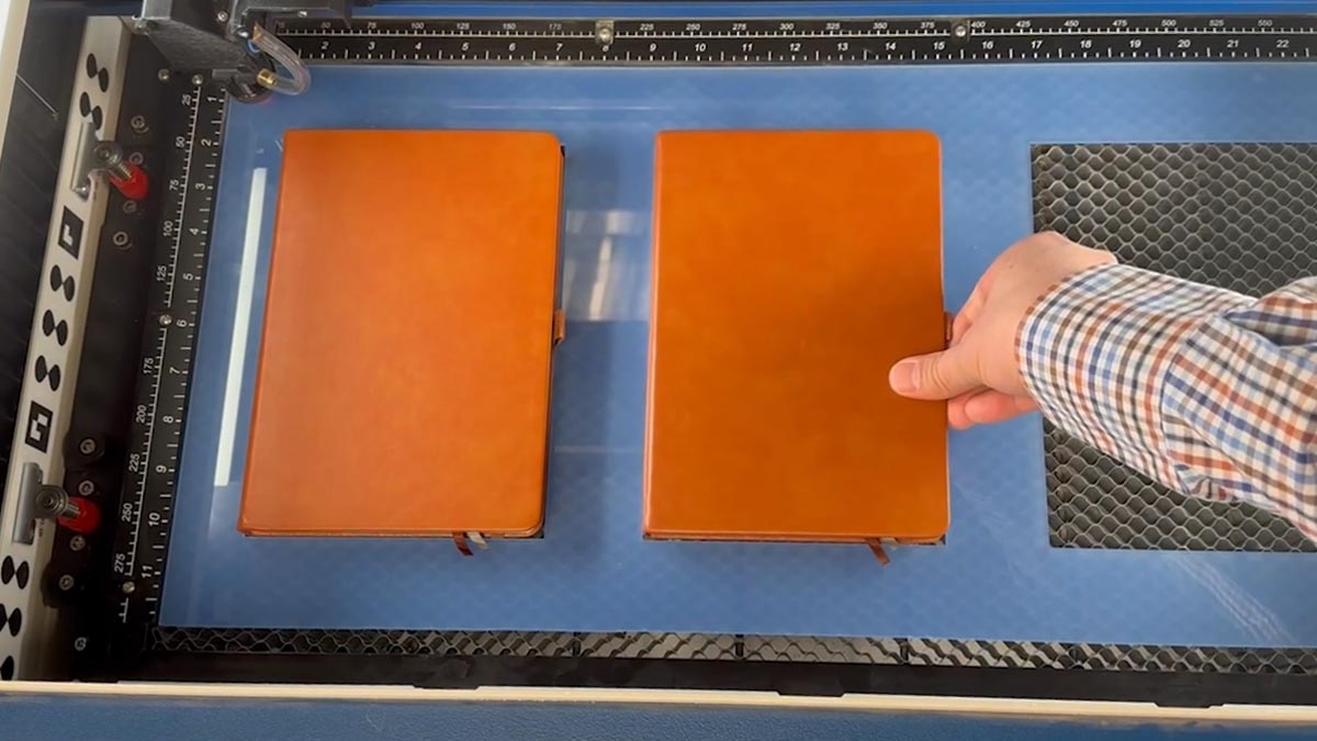 Load the Jig load the jig with blank notebooks