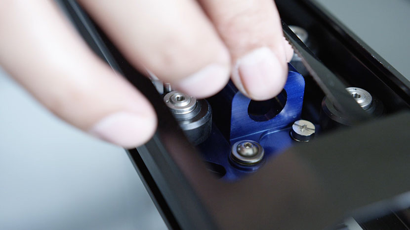 Move the lens carriage left and right a few times to ensure proper alignment. Moving the lens assembly back and forth along the X-Axis.