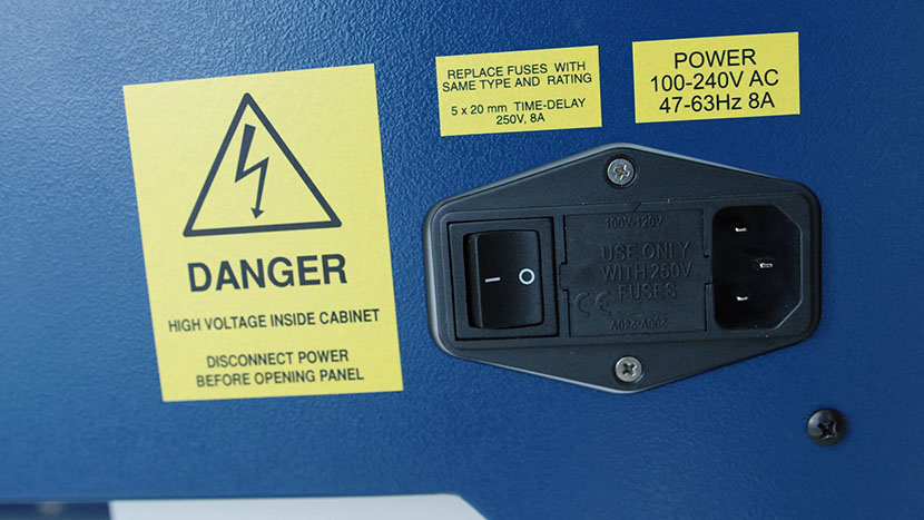 Next to the main power switch, you'll find the plug for the machine's power cord. The power switch and plug.