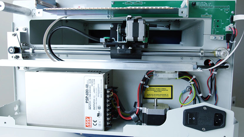The right side of the machine houses the power supply, Y-Axis rail, and the X- and Z-Motors. The interior of the right side of the machine.