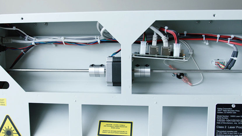 The fan control board is positioned above the Y-Motor and the Y-Axis drive system. The interior of the back side of the machine.