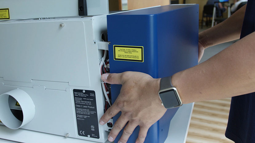 Remove the Zing's left side panel. Removing the left side panel of the Epilog Laser Zing.