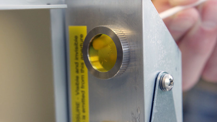 Gently clean the inside of the window at the top of the periscope. Cleaning the inside of the window at the top of the periscope.