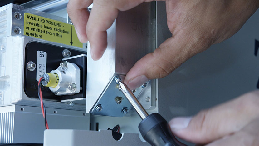 Remove the mirror at the bottom of the periscope housing. Unscrewing the mirror at the bottom of the periscope housing.