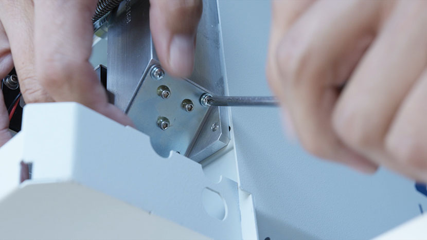 Reinsert the mirror at the bottom of the periscope. Reinserting the mirror at the bottom of the periscope.