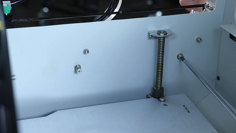 Loosen the two power supply captive screws. Loosening the two power supply captive screws.