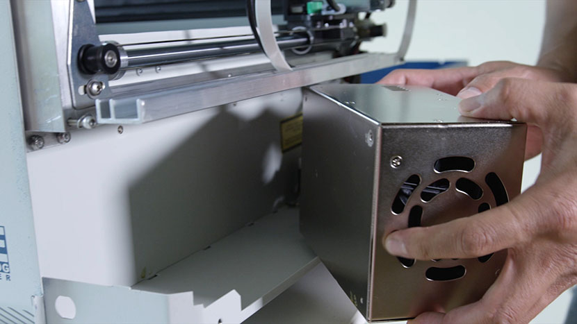 Remove the power supply. Pulling the power supply out of the chassis.