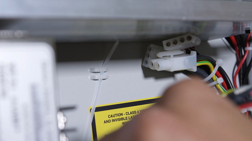 Loop a zip tie on to the chassis and reconnect the power connections. Looping a zip tie around the chassis loops.