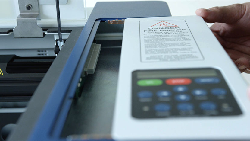 Slide the display unit into place and tighten its two captive screws. Sliding the display panel back into its housing.