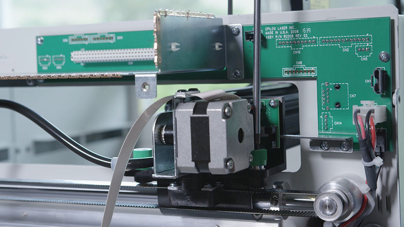 Loosely install the back green captive screw. Screwing in the back right captive screw.