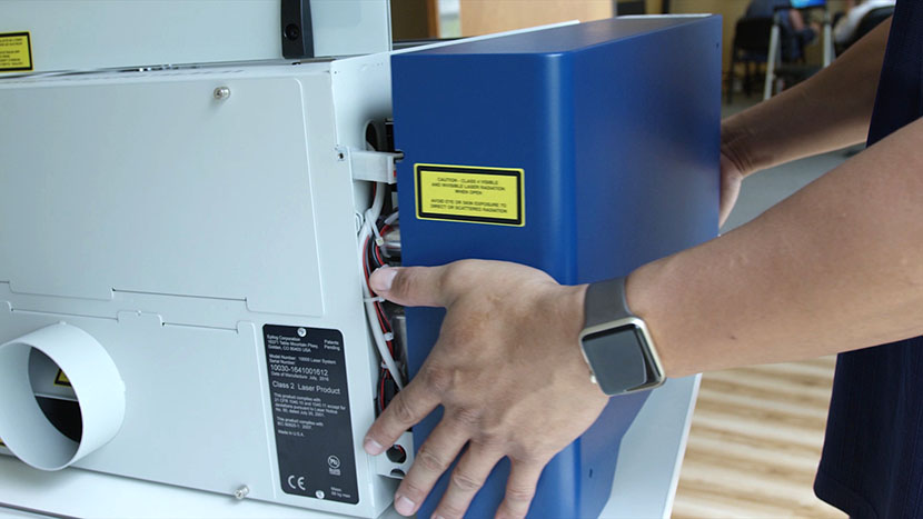 Remove the left side panel. Pulling away the machine's left side panel.