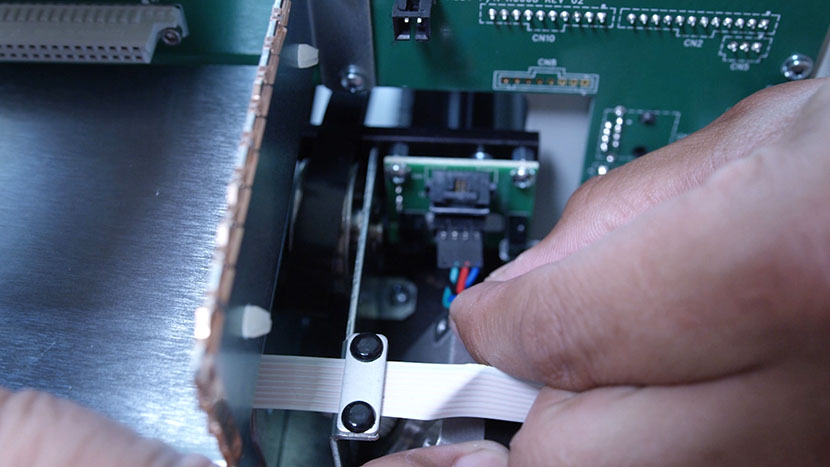 Reconnect the motor's electrical connection. Preparing to plug in the moto'rs electrical connection.