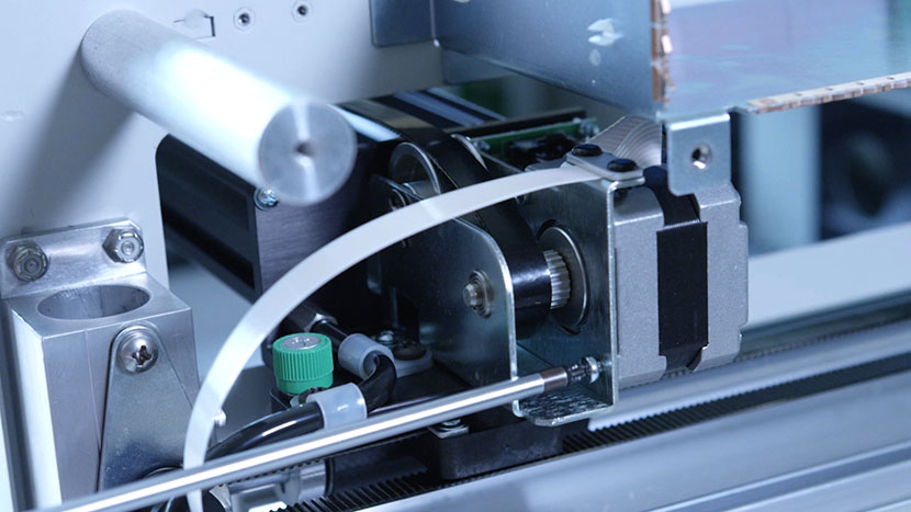 Install the bottom mounting screw. Inserting the bottom x-motor mounting screw.