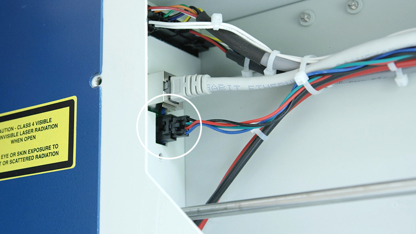 Unplug the Y-Motor electrical connection. The Y-Motor electrical connection plugged in to the left side of the rear compartment.